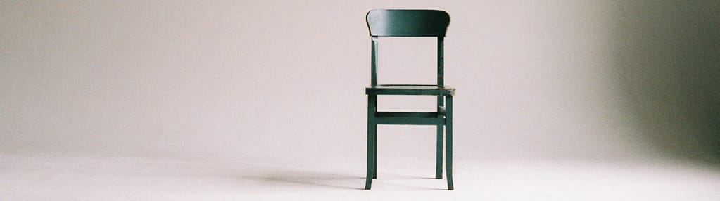Photo by Paula Schmidt: https://www.pexels.com/photo/wooden-chair-on-a-white-wall-studio-963486/